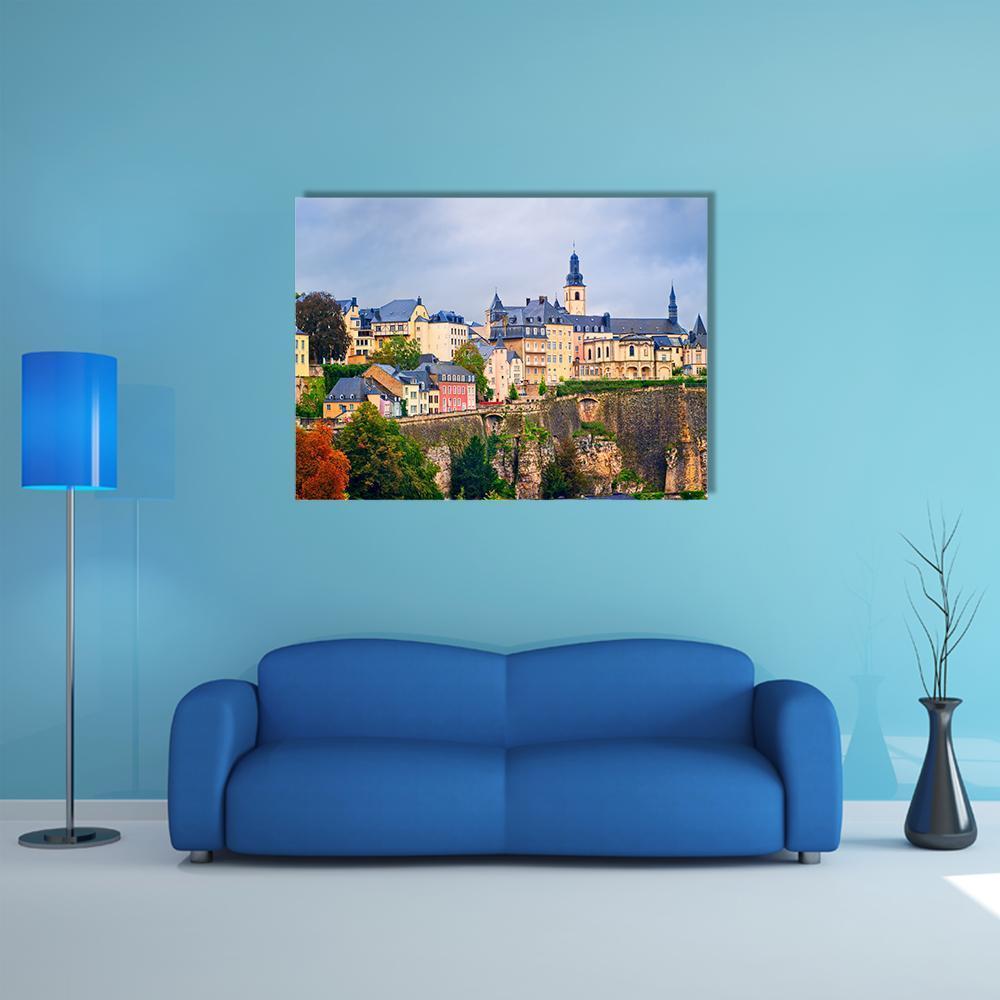 Luxembourg Old Town Cityscape Canvas Wall Art in beige, green and blue, single panel hung on a wall