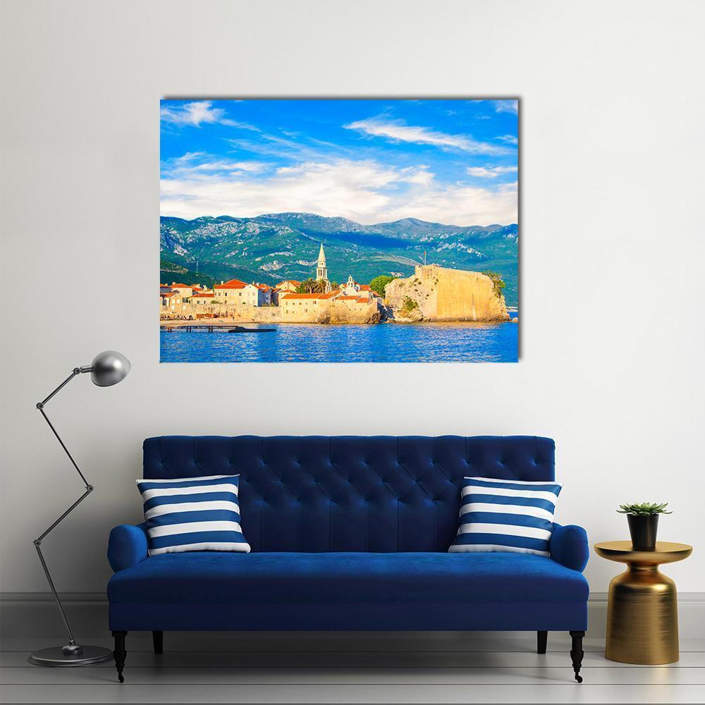 Budva Old Town Fortress by the Sea Canvas Wall Art in beige, orange and blue, single panel hung on a wall