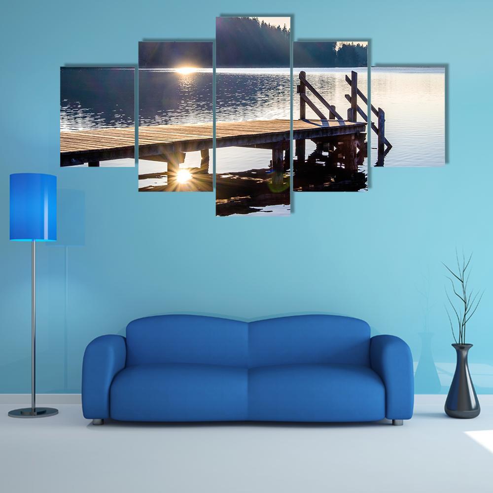 Old Wooden Jetty at Sunset Canvas Wall Art in white, brown and blue, 5 panel Star layout hung on a wall