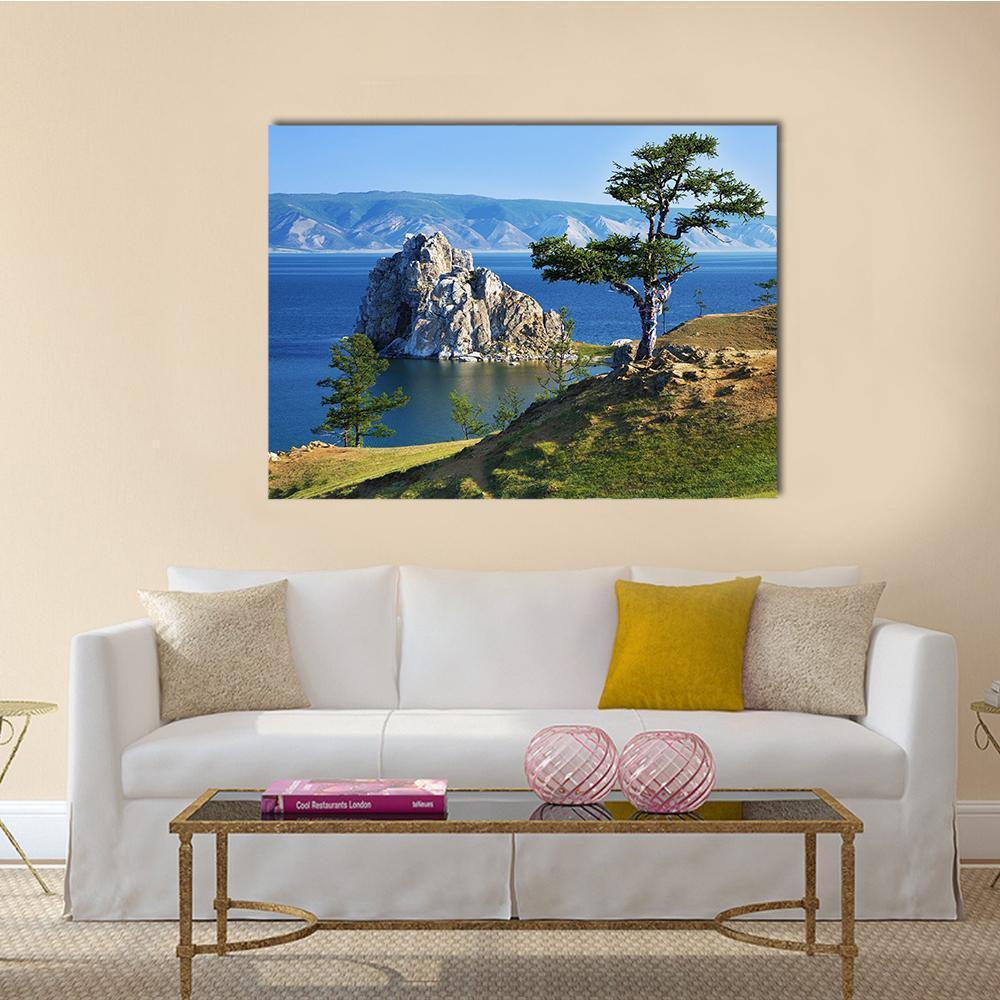 Rocky Island Tree by Lake Canvas Wall Art in brown, green and blue, single panel hung on a wall