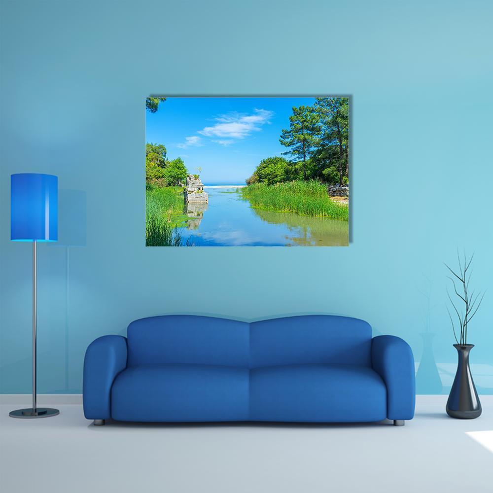 Olympos Stream with Stone Ruins Canvas Wall Art in green and blue, single panel hung on a wall