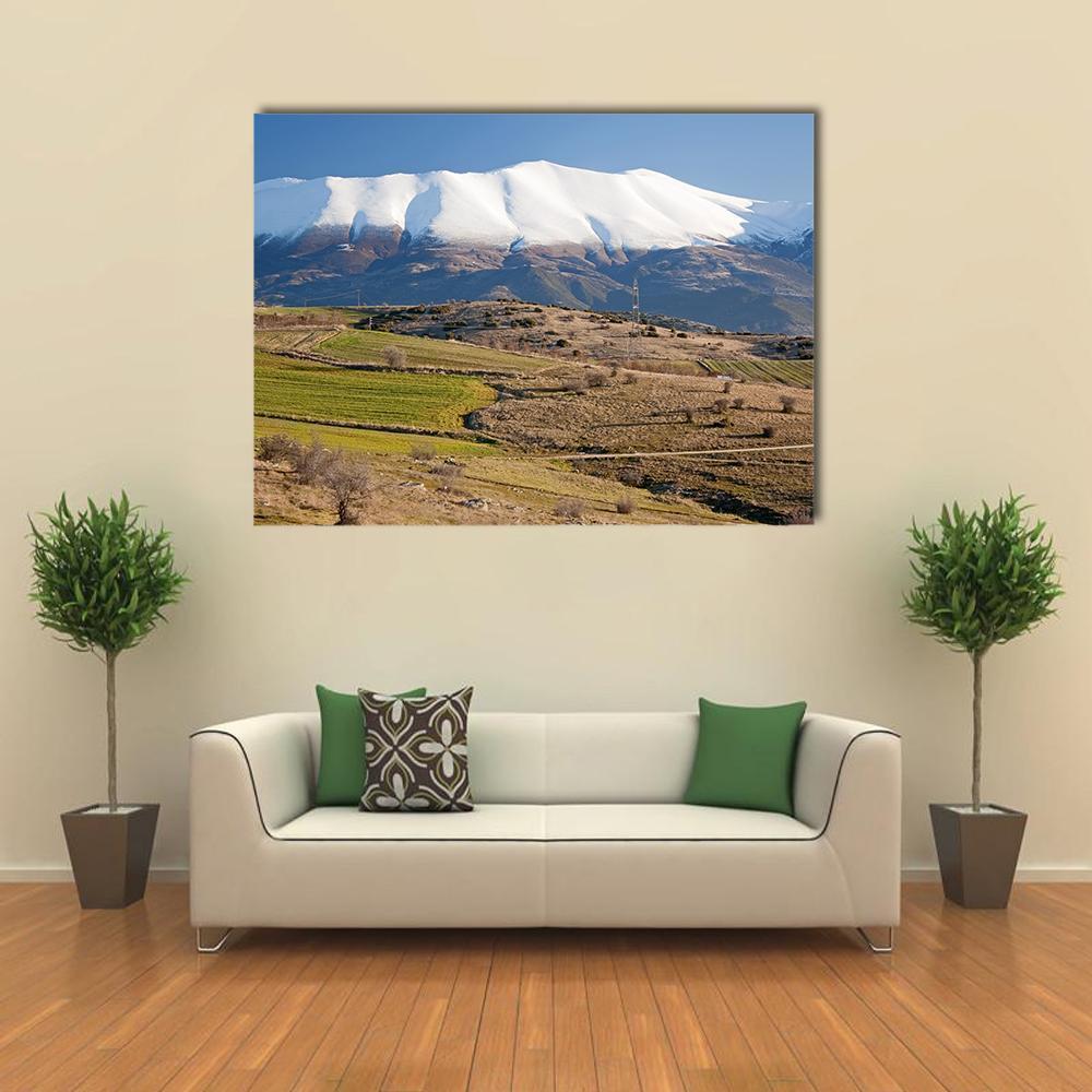 Olympus Mountain Winter Landscape Canvas Wall Art in white, brown and blue, single panel hung on a wall