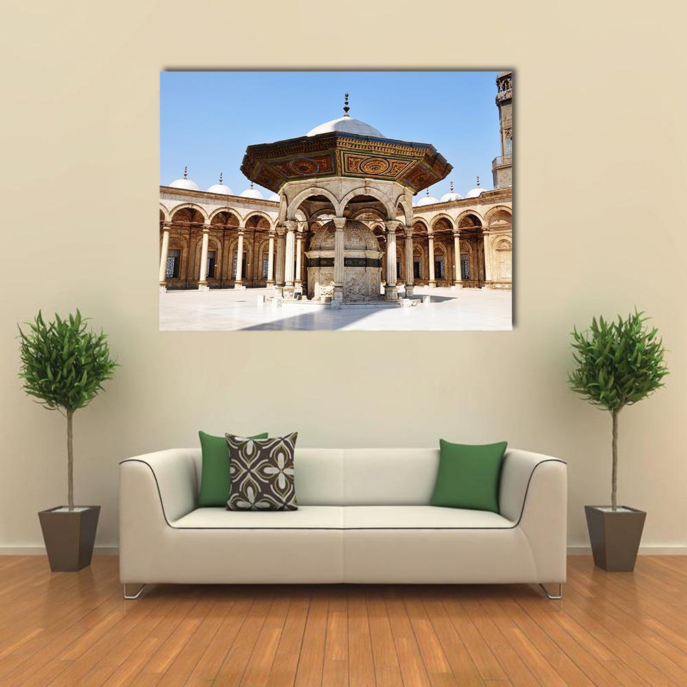 Omayyad Mosque Courtyard Canvas Wall Art in beige, gold and blue, single panel hung on a wall