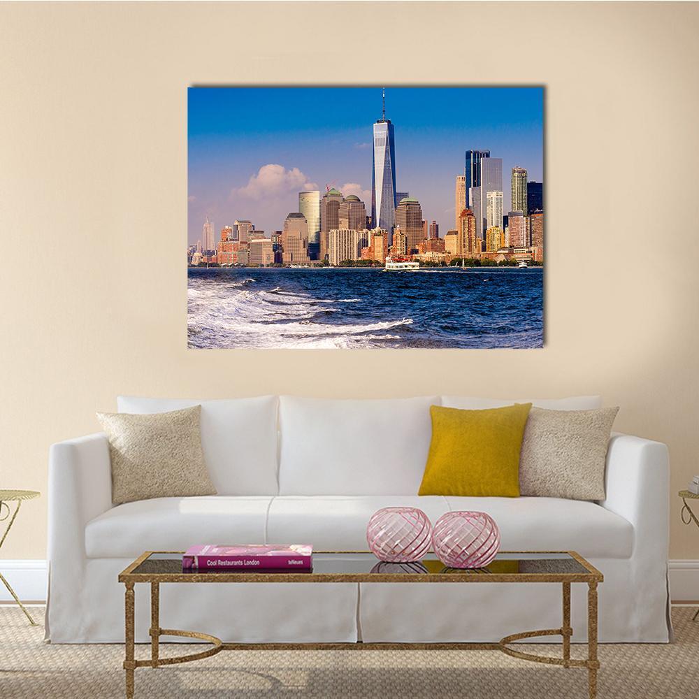 One World Trade Center Skyline Over Water Canvas Wall Art in white, brown and blue, single panel hung on a wall