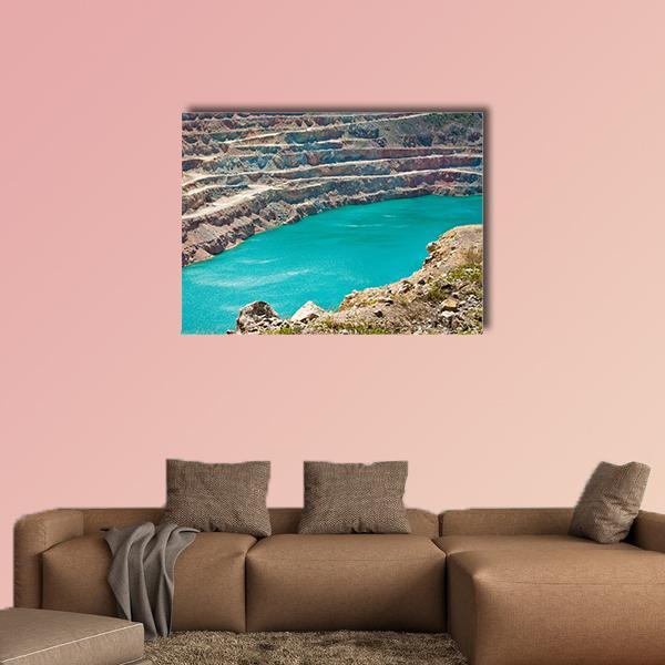 Open-pit Mine with Turquoise Lake Canvas Wall Art in brown and blue, single panel hung on a wall