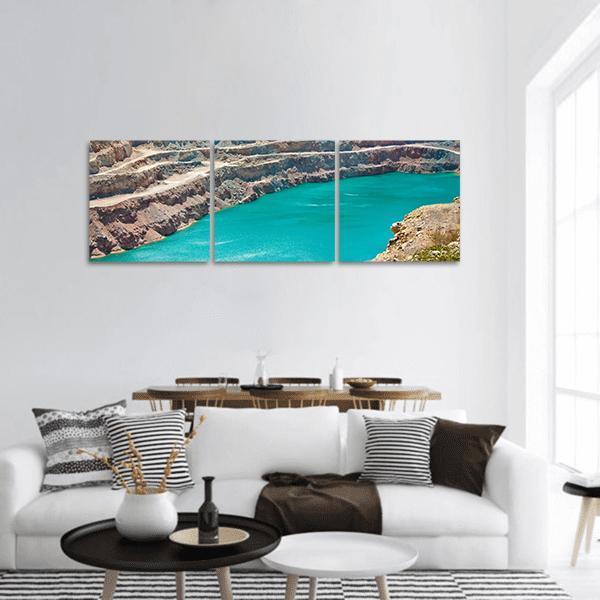 Open Pit Mine with Turquoise Lake Panoramic Canvas Wall Art in beige, brown and blue, hung on a wall