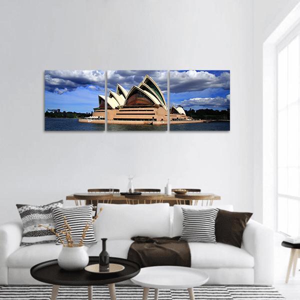 Sydney Opera House Over Water Panoramic Canvas Wall Art in white, beige and blue, hung on a wall