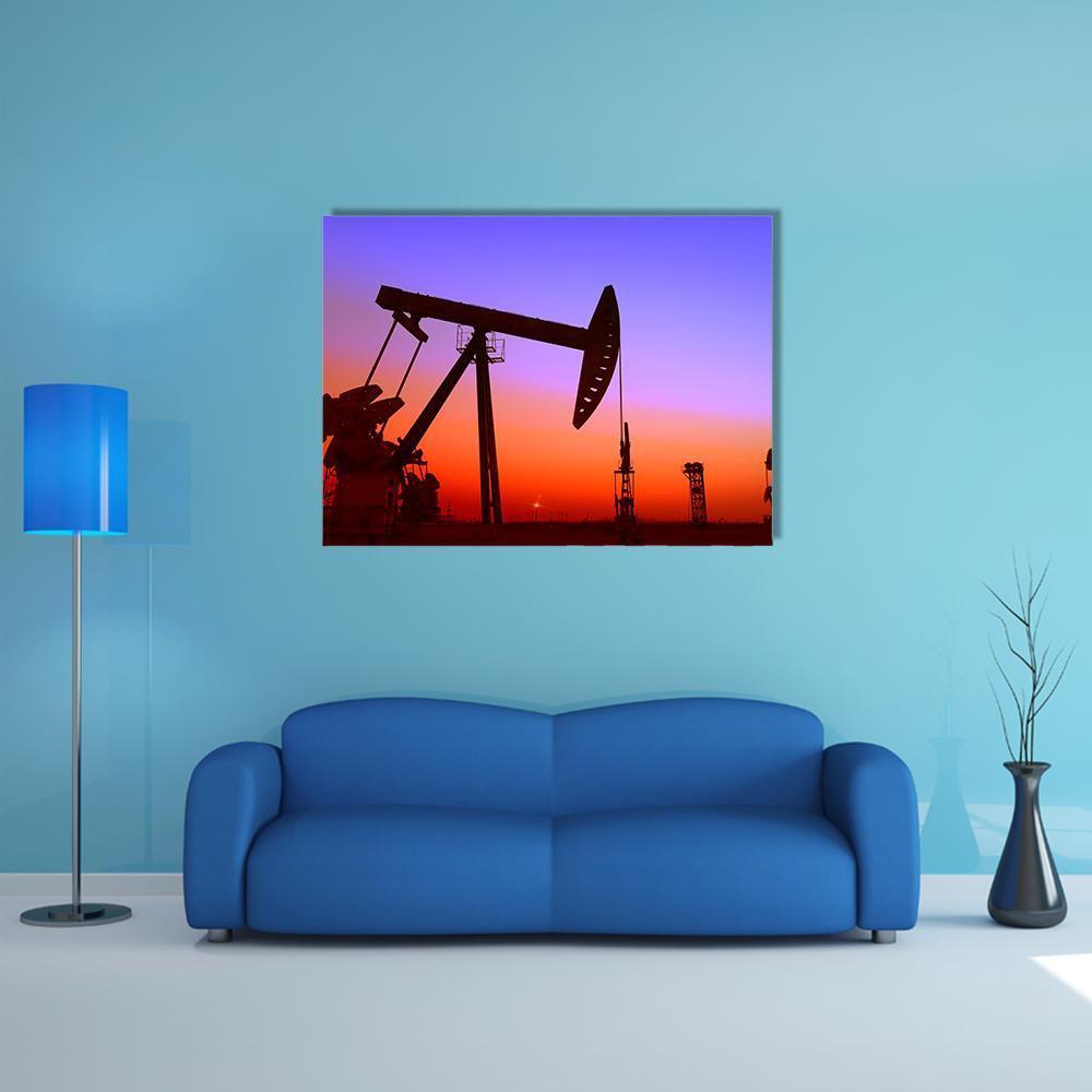 Pumpjack Silhouette at Sunset Canvas Wall Art in black, orange and purple, single panel hung on a wall
