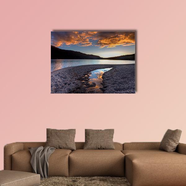 Pend Oreille Lake Sunset Reflection Canvas Wall Art in black, orange and blue, single panel hung on a wall