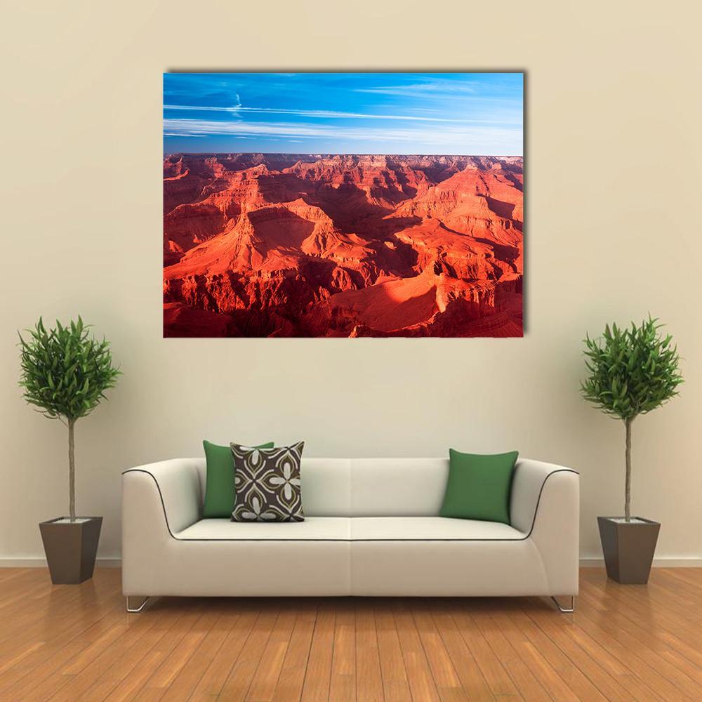 Orange Grand Canyon Canvas Wall Art in red, orange and blue, single panel hung on a wall