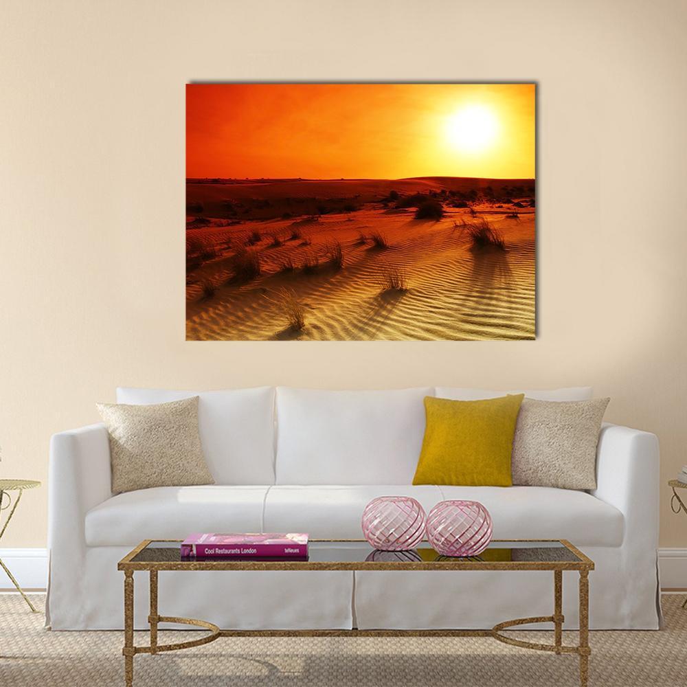Orange Sunset Over Desert Dunes Canvas Wall Art in brown, orange and yellow, single panel hung on a wall