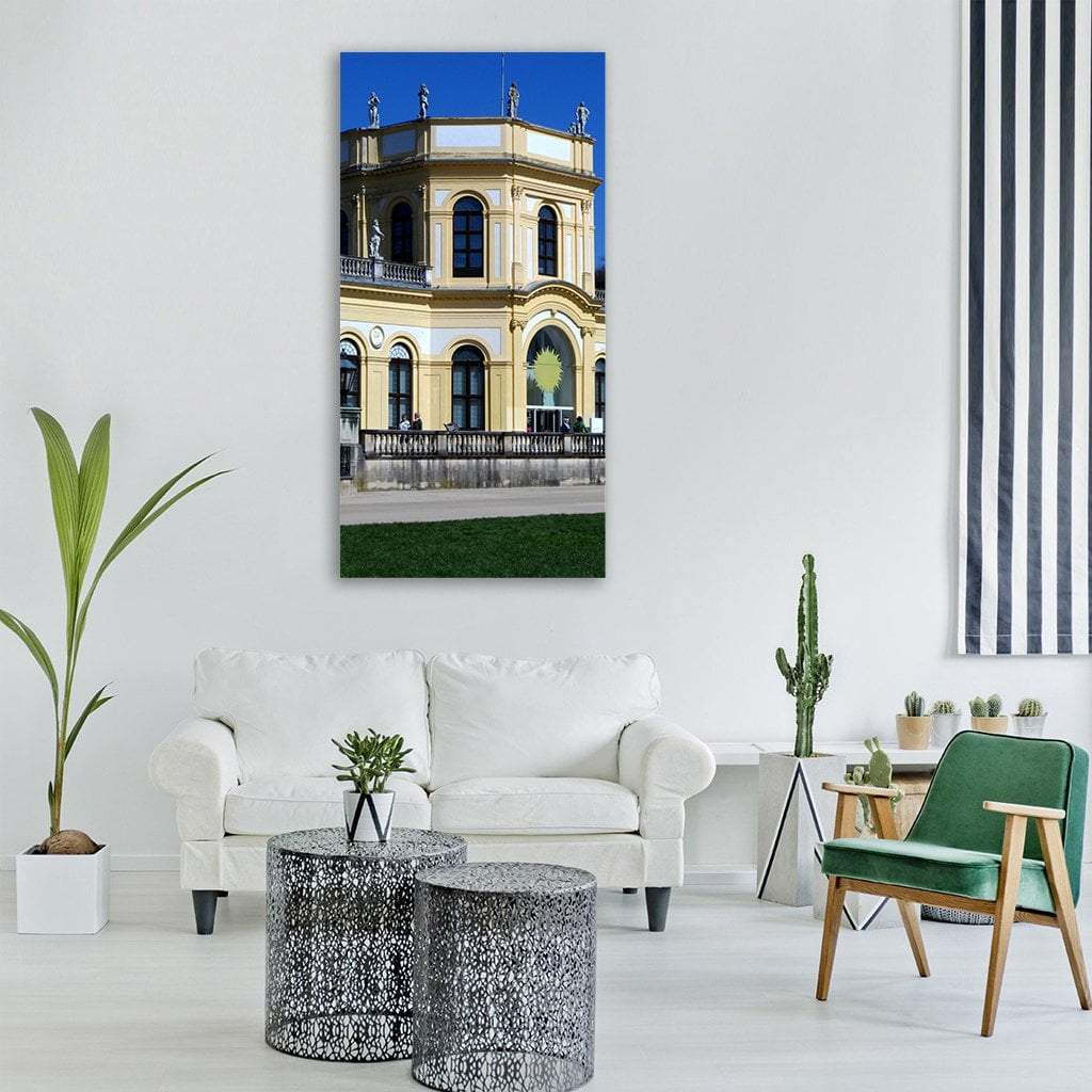 Yellow Ochre Orangery in Kassel Vertical Canvas Wall Art in beige, yellow and blue, single vertical panel hung on a wall