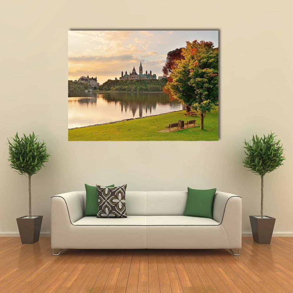 Ottawa Skyline Over River at Sunrise Canvas Wall Art in orange, yellow and green, single panel hung on a wall