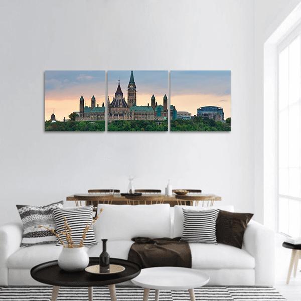 Ottawa Skyline with Peace Tower Panoramic Canvas Wall Art in orange, green and blue, hung on a wall