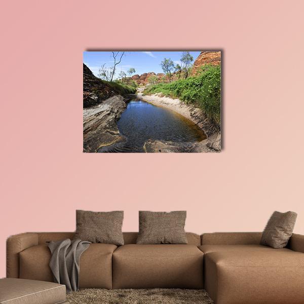 Outback Beehive Rock Formations Canvas Wall Art in brown, green and blue, single panel hung on a wall