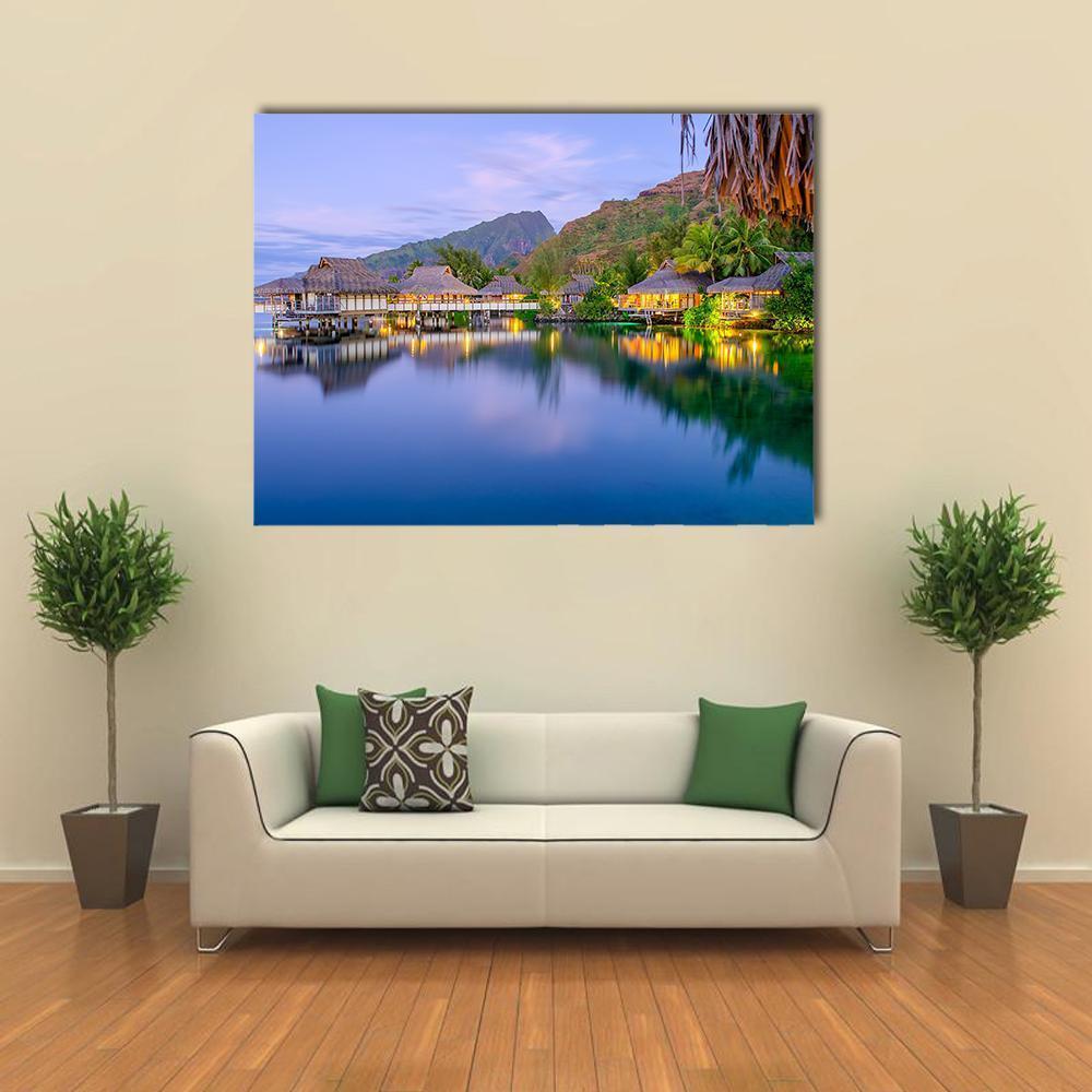 Dusk Overwater Bungalows in Bora Bora Canvas Wall Art in yellow, blue and purple, single panel hung on a wall