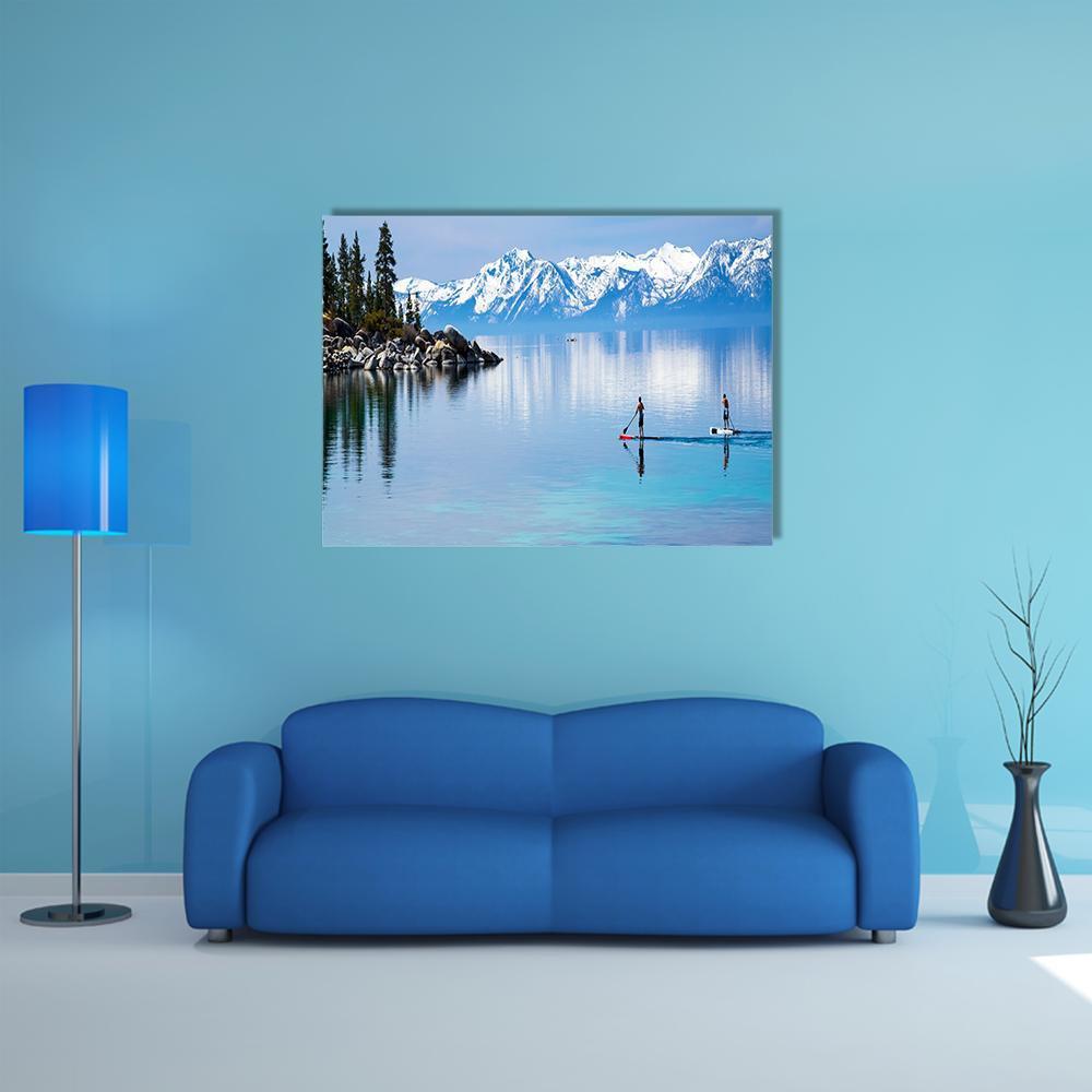 Paddleboarders on Mountain Lake Canvas Wall Art in white and blue, single panel hung on a wall
