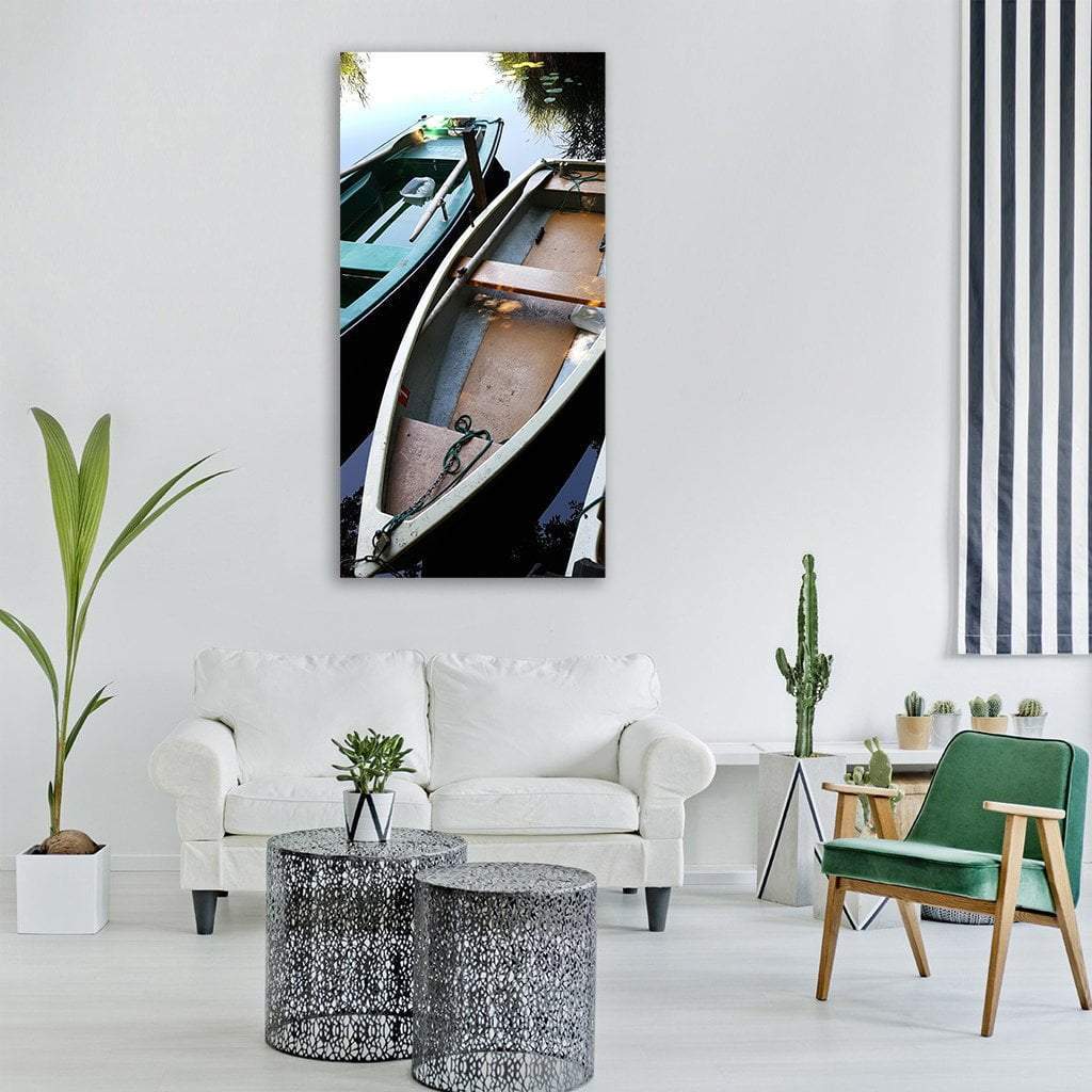 Two Rowboats on Calm Lake Vertical Canvas Wall Art in gray, brown and blue, single vertical panel hung on a wall