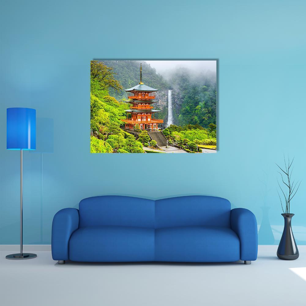 Five-tier Pagoda with Cascading Waterfall Canvas Wall Art in gray, orange and green, single panel hung on a wall