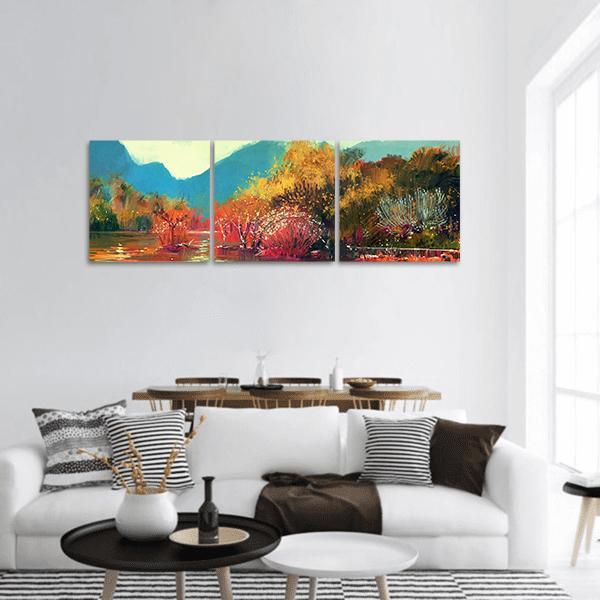 Autumn Forest by Mountain Lake Panoramic Canvas Wall Art in orange, yellow and blue, hung on a wall