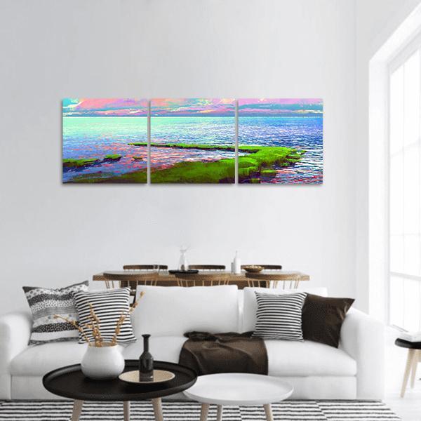 Mossy Coastline Seascape at Dawn Panoramic Canvas Wall Art in green, blue and pink, hung on a wall