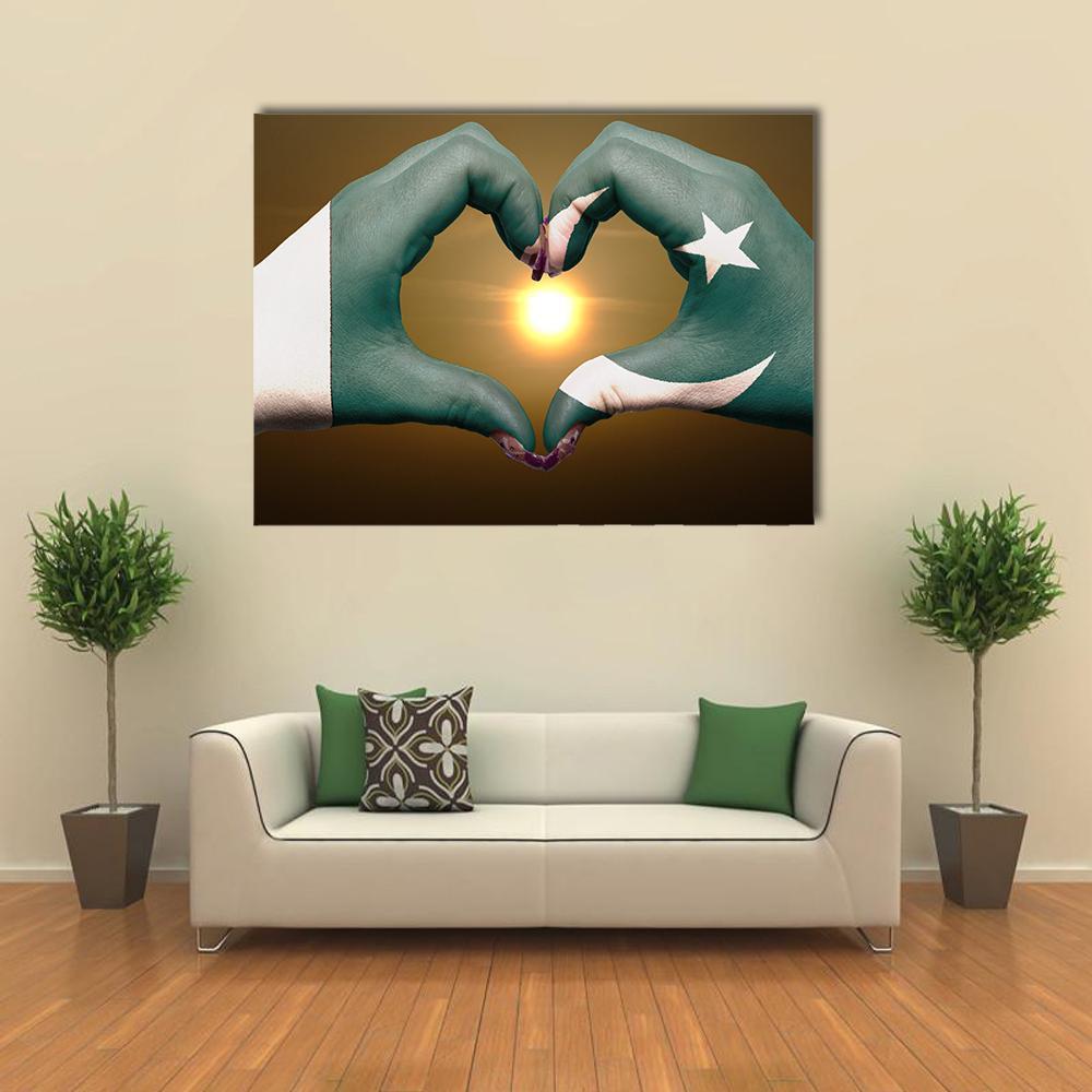 Hands Forming Heart Over Pakistani Flag Canvas Wall Art in white, brown and green, single panel hung on a wall