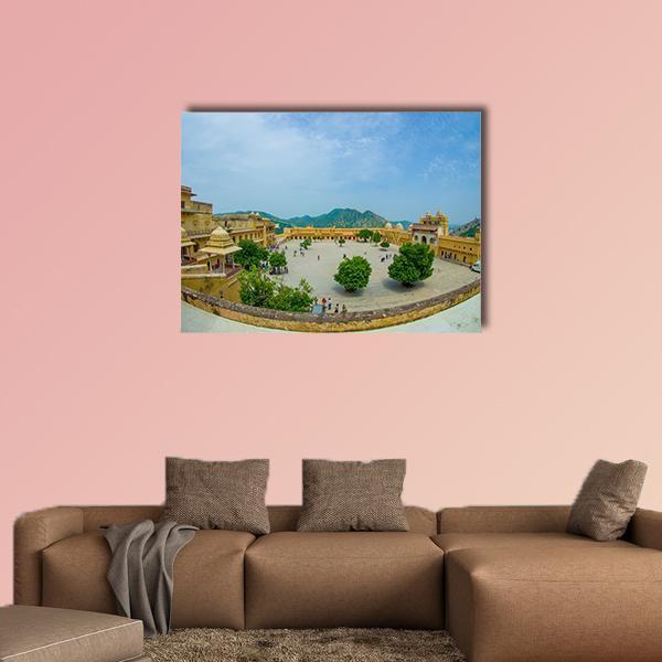 Udaipur Fort Palace Courtyard Canvas Wall Art in beige, yellow and blue, single panel hung on a wall