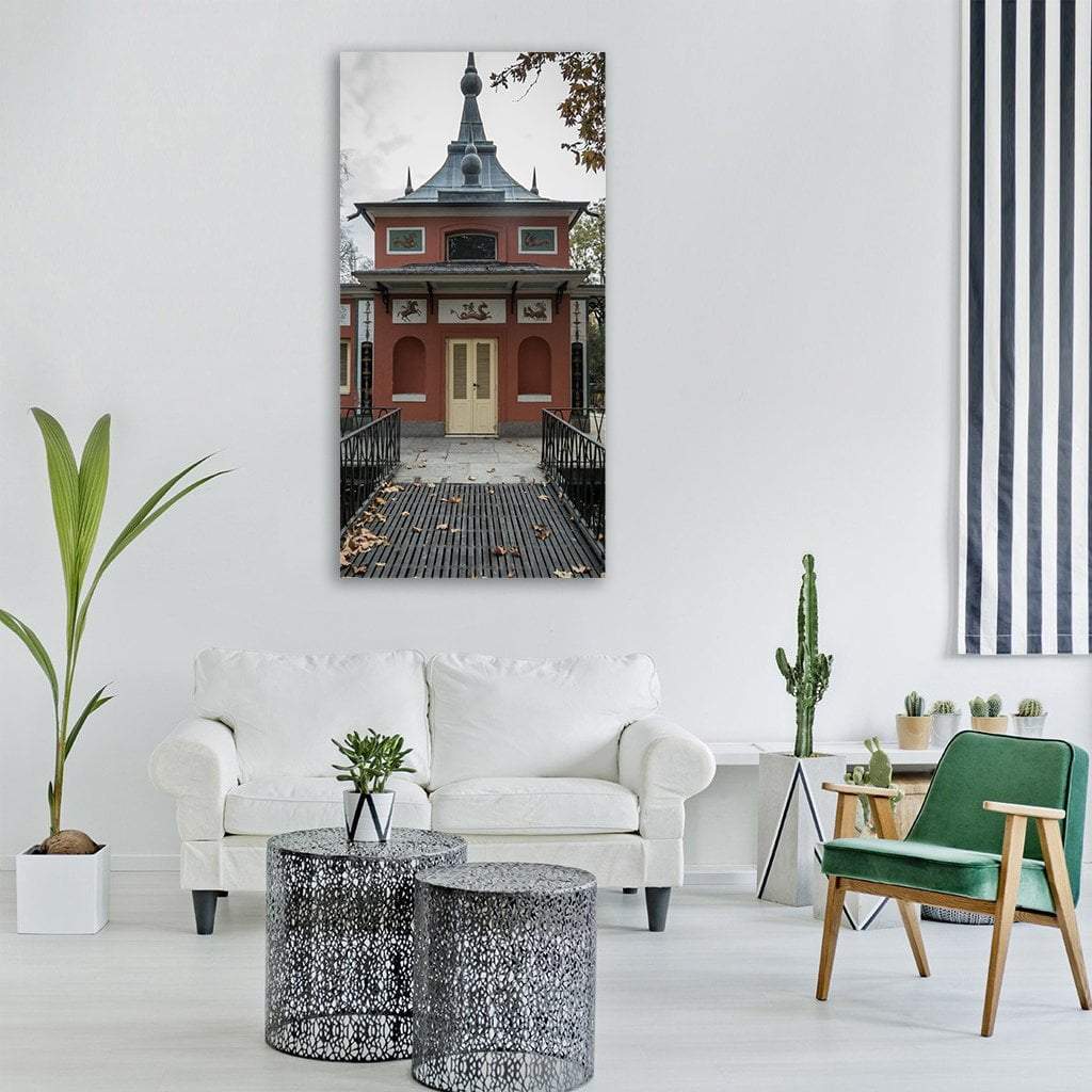 Palace with Ornate Spire and Bridge Vertical Canvas Wall Art in black, gray and red, single vertical panel hung on a wall
