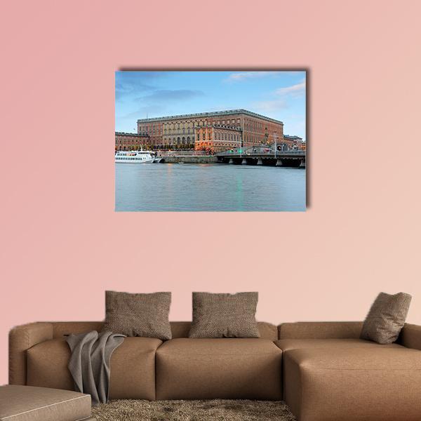 Stockholm Palace on Waterfront Canvas Wall Art in brown and blue, single panel hung on a wall