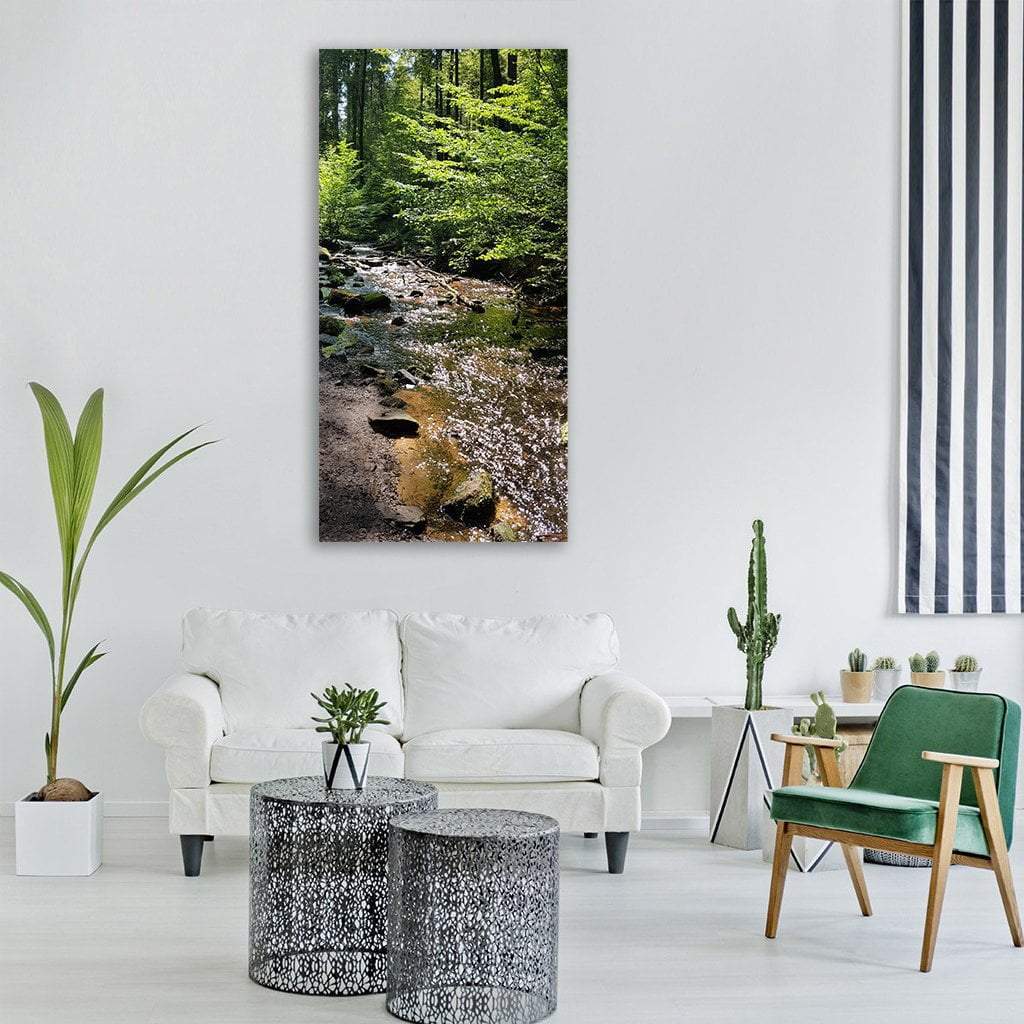 Palatinate Forest Creek Vertical Canvas Wall Art in brown and green, single vertical panel hung on a wall