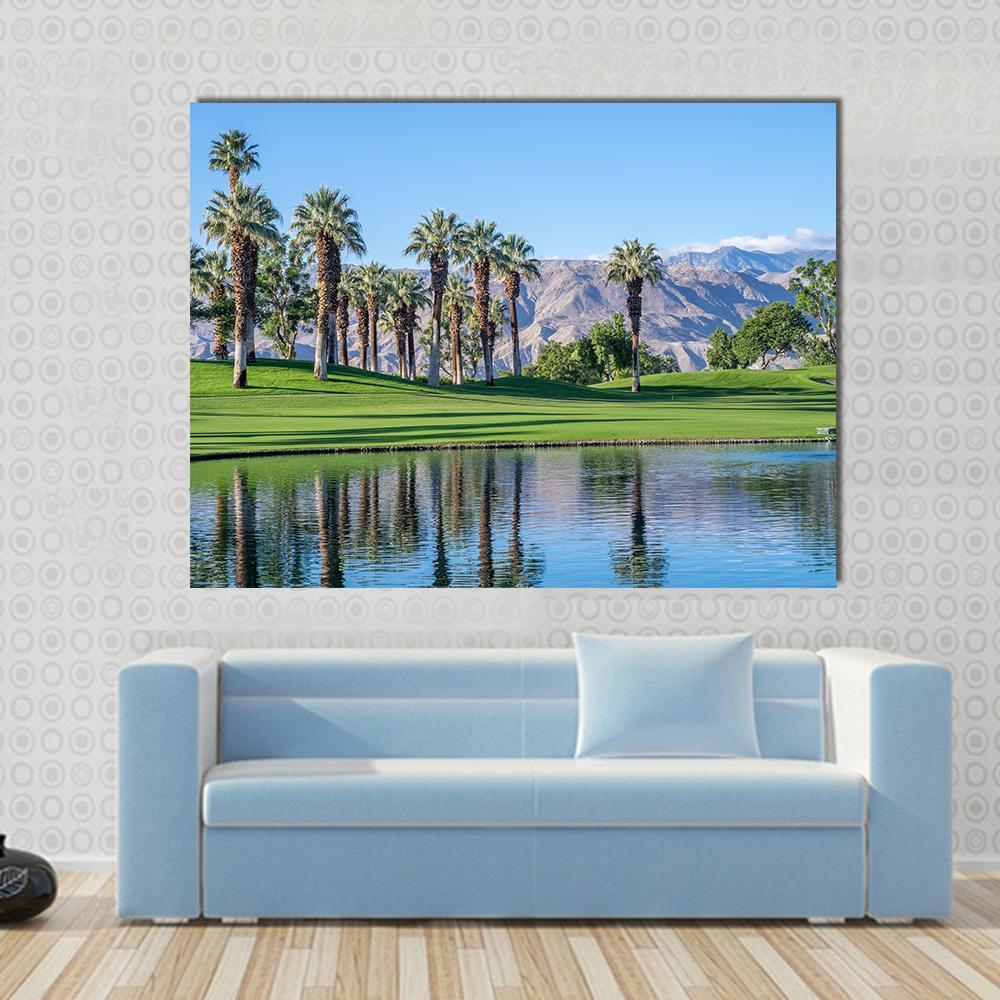 Palms Reflecting in Water Canvas Wall Art in brown, green and blue, single panel hung on a wall