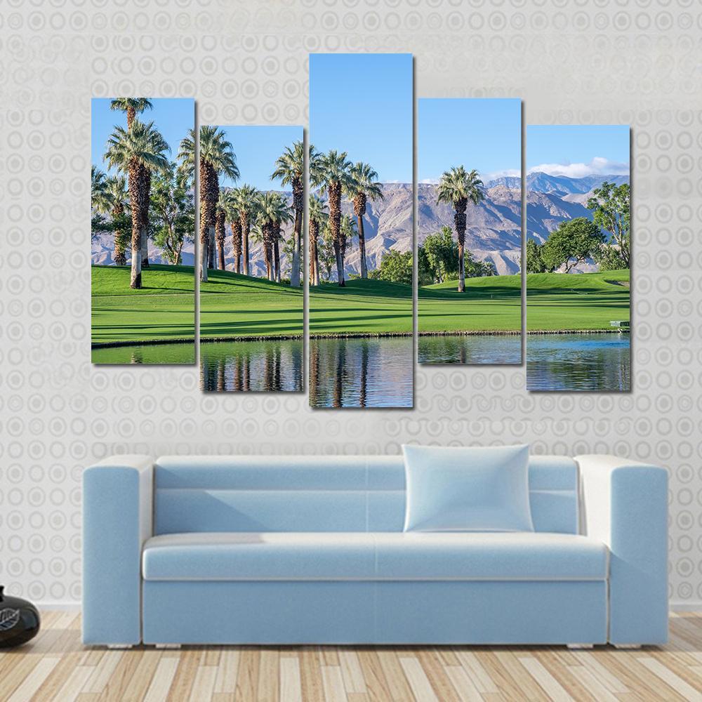 Palms Reflecting in Water Canvas Wall Art in brown, green and blue, 3 panel horizontal set hung on a wall