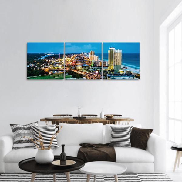 Panama City Beach Skyline at Twilight Panoramic Canvas Wall Art in black, yellow and blue, hung on a wall