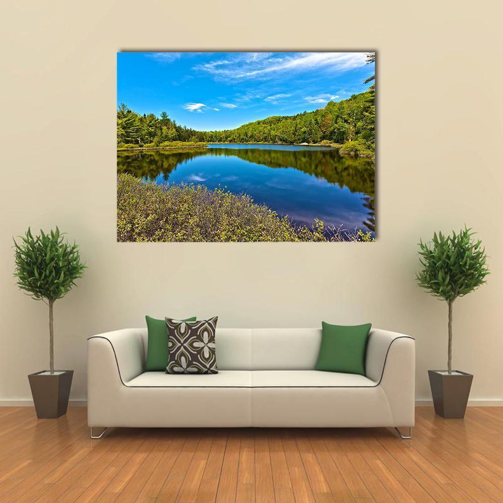 Sacacomie Lake Landscape Canvas Wall Art in green and blue, single panel hung on a wall