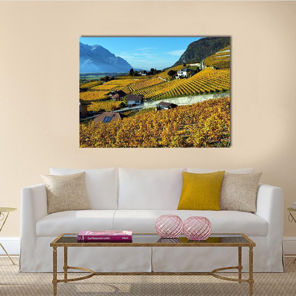 Autumn Vineyard Panorama Canvas Wall Art in yellow, green and blue, single panel hung on a wall