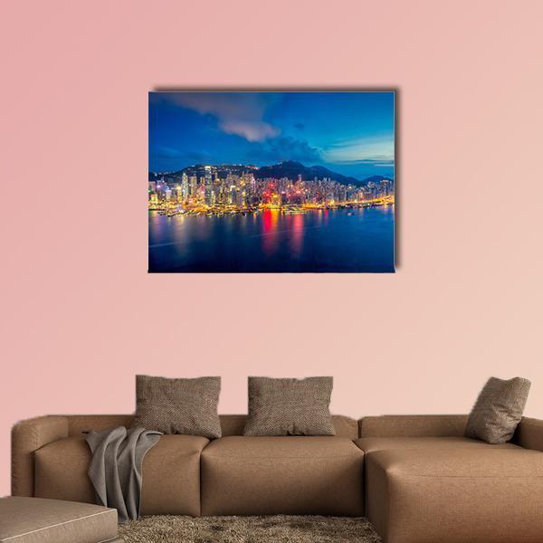 Hong Kong Skyline at Sunset Canvas Wall Art in orange, yellow and blue, single panel hung on a wall
