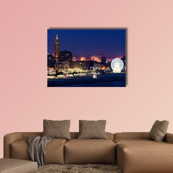 Night City Skyline with Ferris Wheel Canvas Wall Art in yellow, blue and navy, single panel hung on a wall