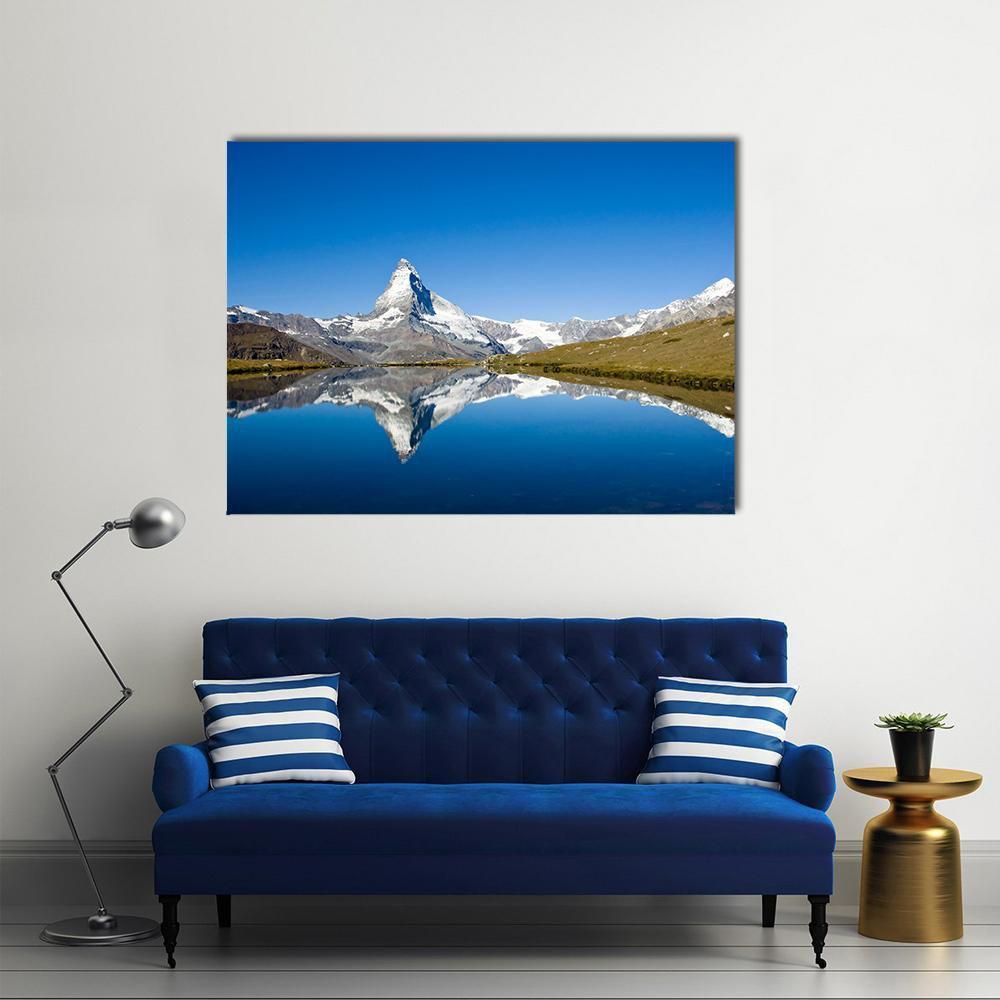 Snow-capped Matterhorn Reflection Canvas Wall Art in white, brown and blue, single panel hung on a wall