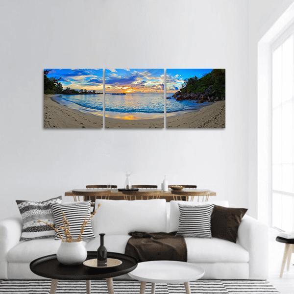 Tropical Beach at Sunset Panoramic Canvas Wall Art in beige, orange and blue, hung on a wall