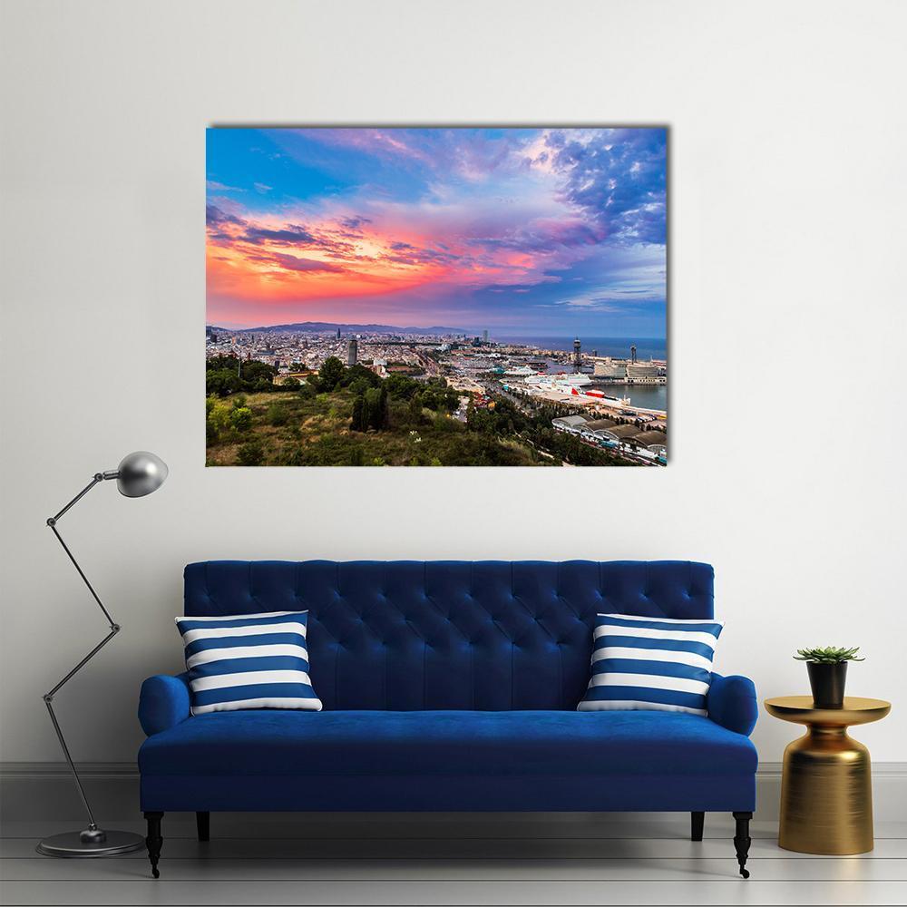 Sunset Over Barcelona Harbor Canvas Wall Art in orange, blue and pink, single panel hung on a wall
