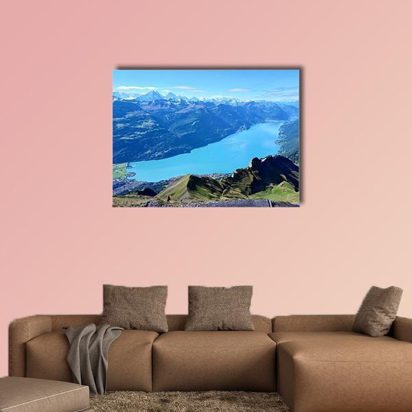 Brienz Lake and Mountain Range Canvas Wall Art in green and blue, single panel hung on a wall