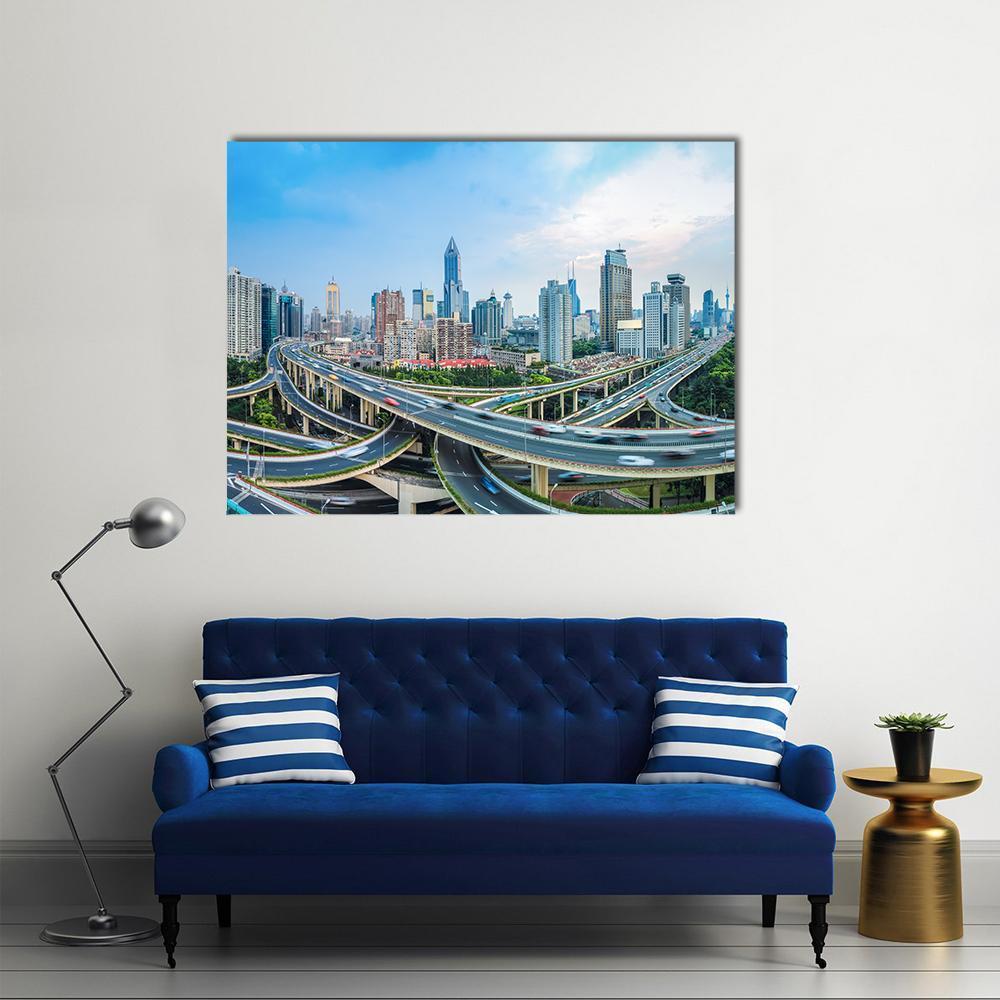 Shanghai Cityscape with Elevated Roads and Blue Sky Canvas Wall Art in gray, green and blue, single panel hung on a wall