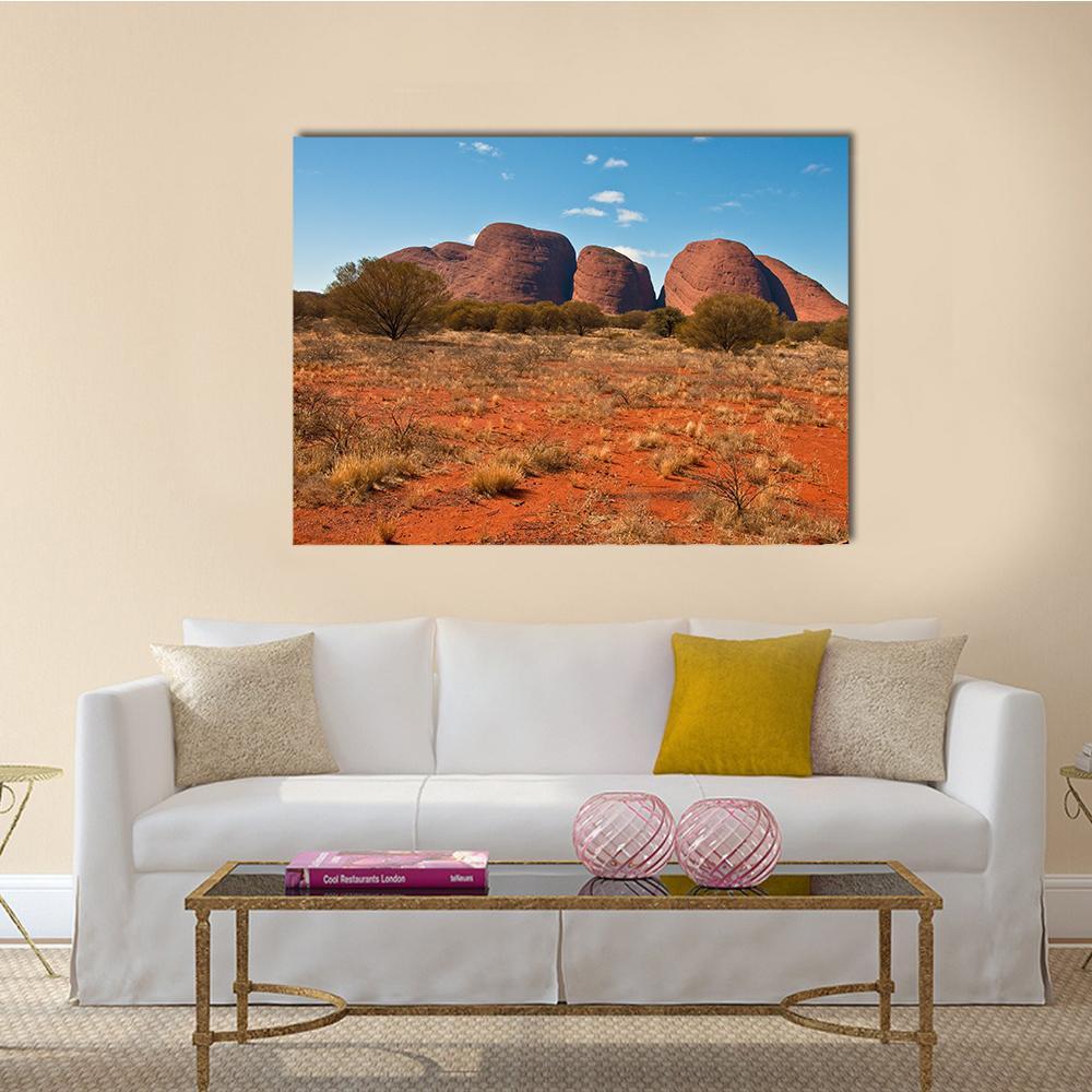 Kata Tjuta Red Desert Rock Domes Canvas Wall Art in red, orange and blue, single panel hung on a wall