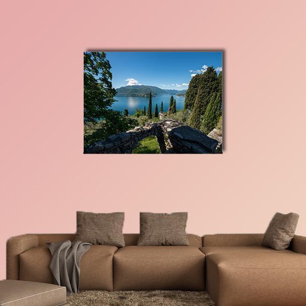 Lake Como Seen Through Stone Archway Canvas Wall Art in gray, green and blue, single panel hung on a wall