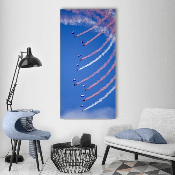Parachuting Air Show Vertical Canvas Wall Art in white, orange and blue, single vertical panel hung on a wall
