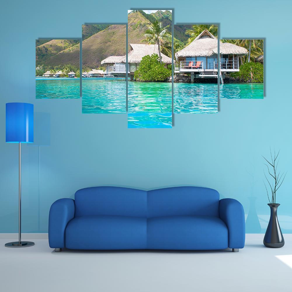 Paradise Overwater Bungalows Canvas Wall Art in brown, green and blue, 5 panel Star layout hung on a wall