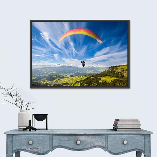 Paraglider Flying Over Mountains Canvas Wall Art in white, green and blue, framed canvas, product view on a white background