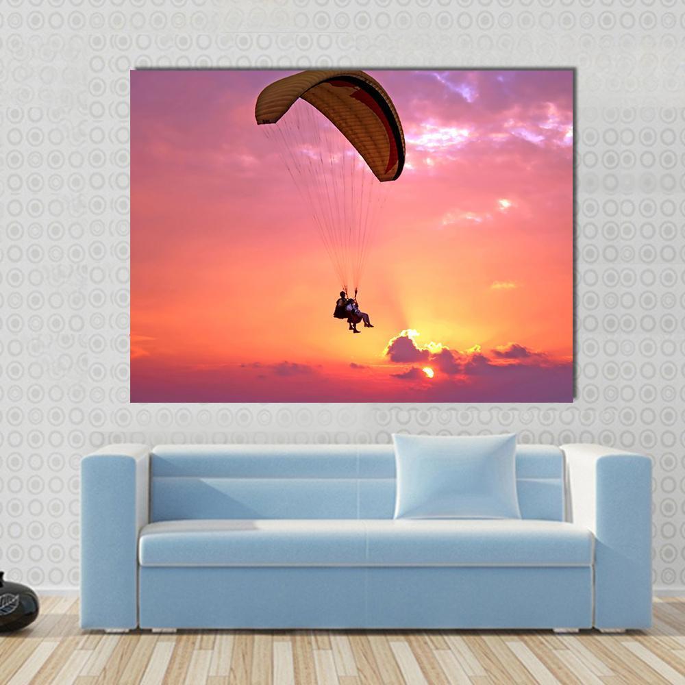 Paragliding at Sunset Canvas Wall Art in orange, purple and pink, single panel hung on a wall