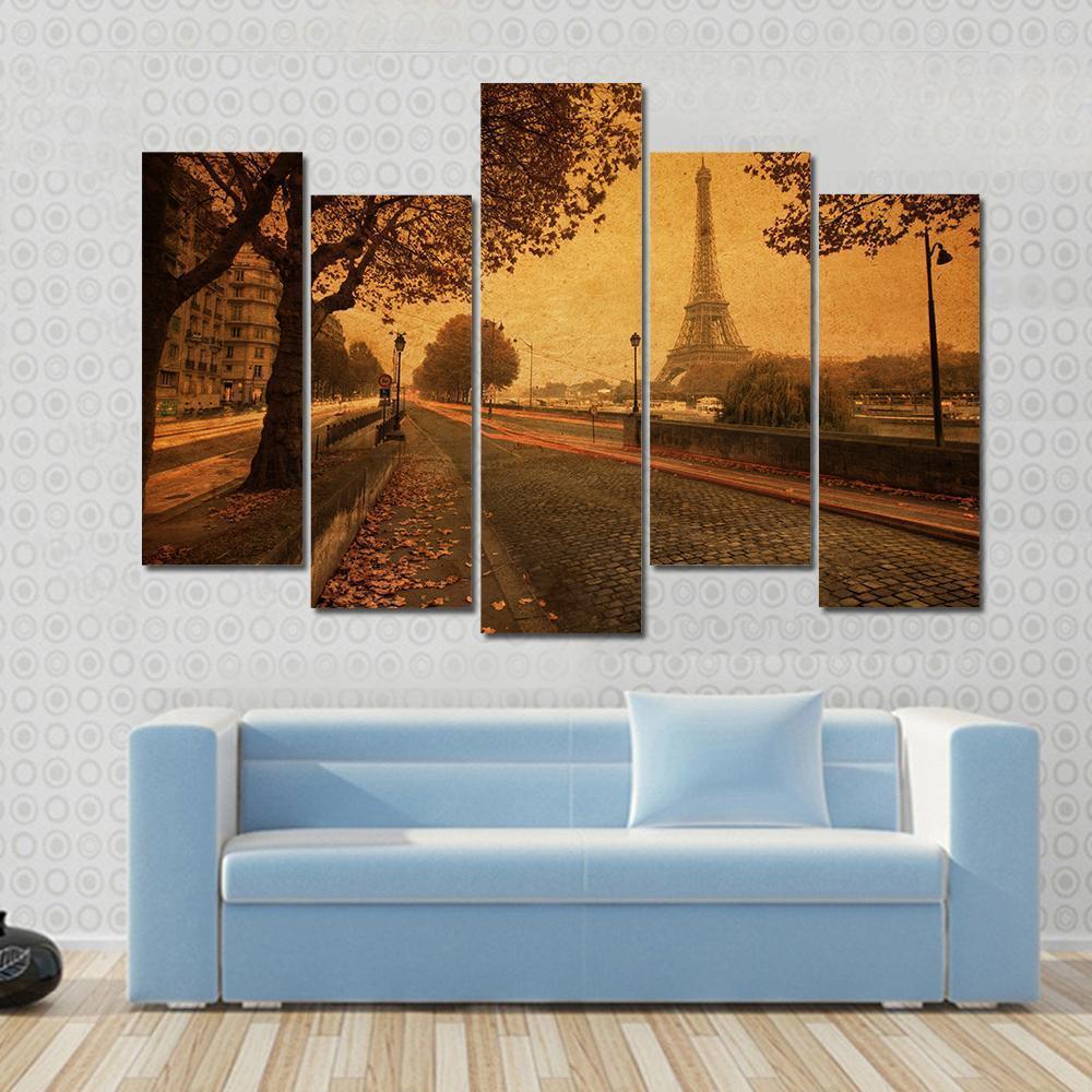 Paris at Dusk with Eiffel Tower Canvas Wall Art in brown, orange and yellow, 4 panel Pop layout hung on a wall