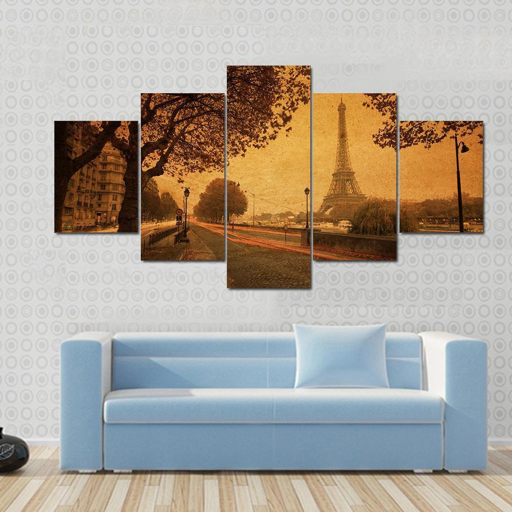 Paris at Dusk with Eiffel Tower Canvas Wall Art in brown, orange and yellow, 4 panel Pop layout hung on a wall
